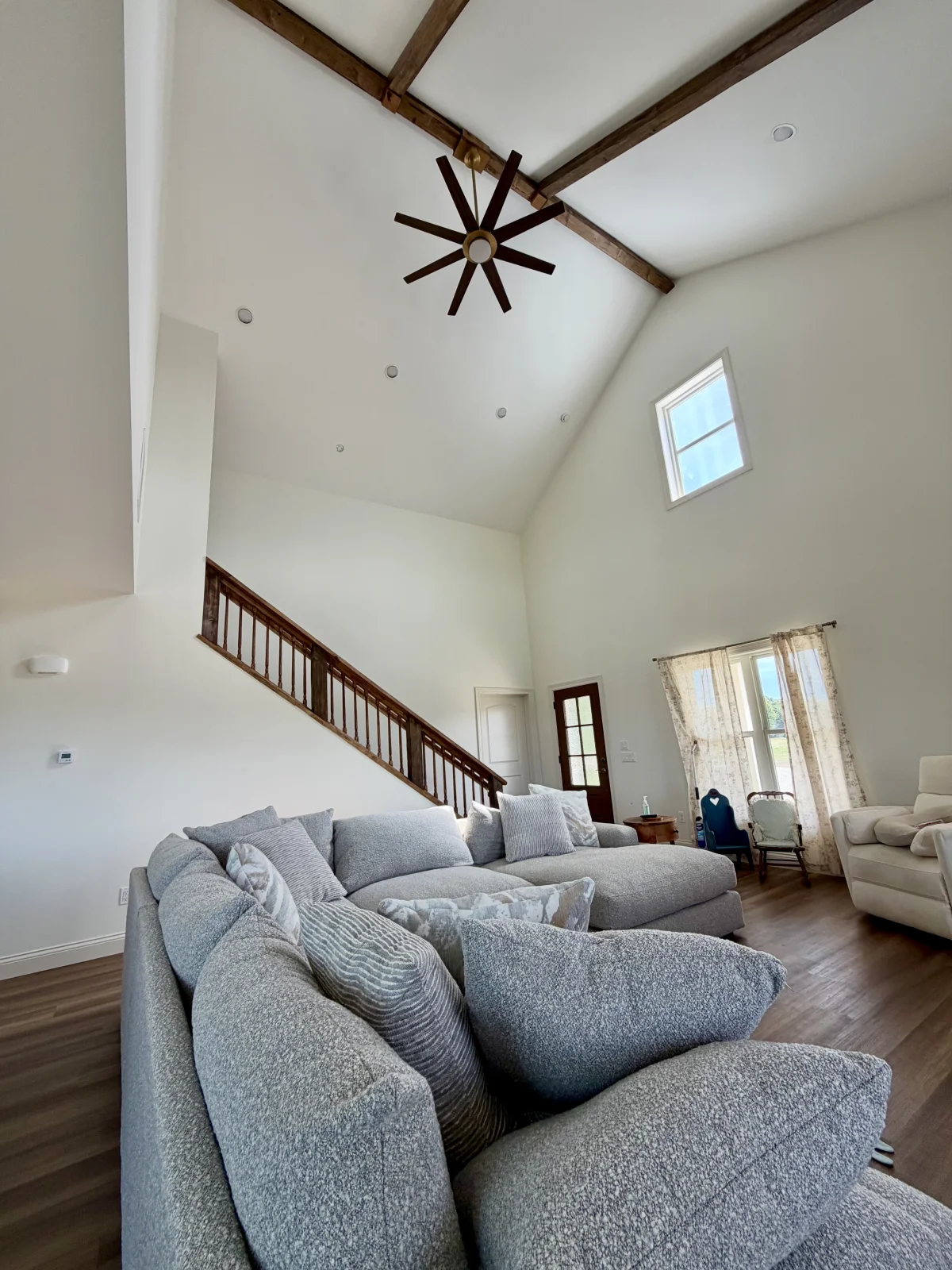Vaulted living room and stair in the New Haven home